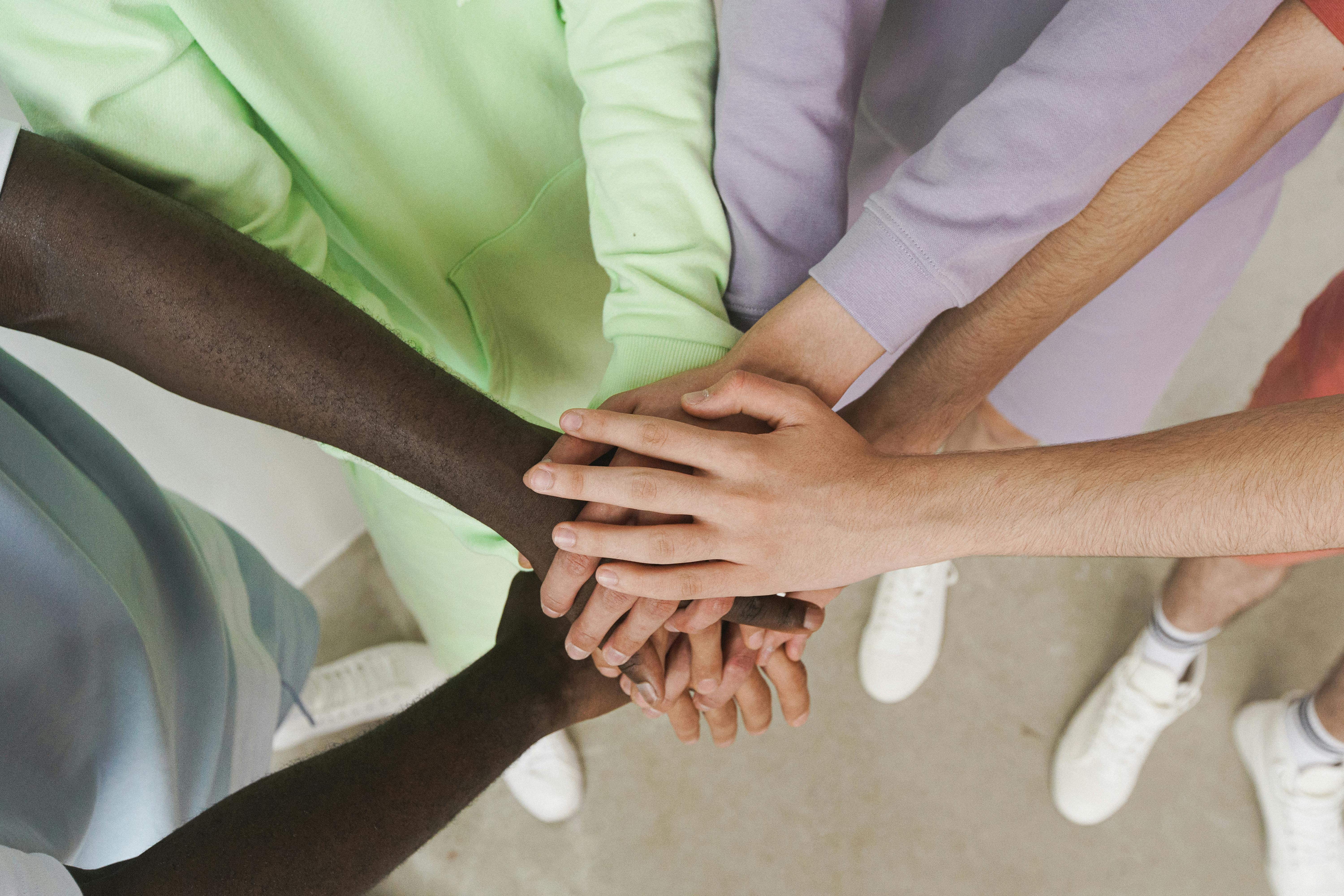 Hands joined together in support.